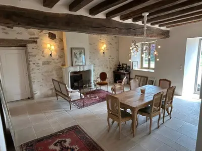 Coin salon dans l'établissement Maison de campagne 10 couchages