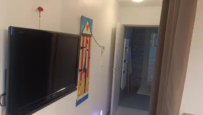 Télévision ou salle de divertissement dans l'établissement Confort & Calme