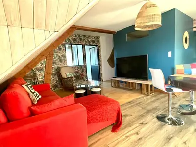 Télévision ou salle de divertissement dans l'établissement Appartement Tagada