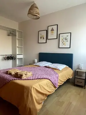 Un ou plusieurs lits dans un hébergement de l'établissement Appartement Tagada