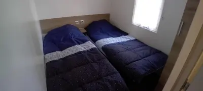 Un ou plusieurs lits dans un hébergement de l'établissement Campsite Mobile Home - 3 Beds - Family Pools