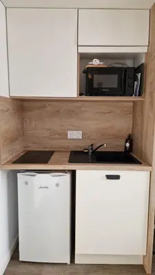 Cuisine ou kitchenette dans l'établissement Nouveau - La Cabine du Capitaine