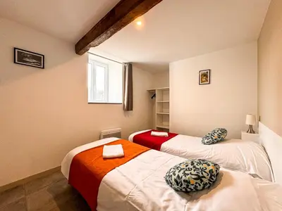 Un ou plusieurs lits dans un hébergement de l'établissement Gîte de Charme à 5 min du Parc, la p'tite Crume