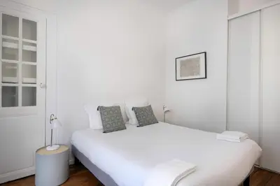 Un ou plusieurs lits dans un hébergement de l'établissement Bel appartement proche de la Place Graslin