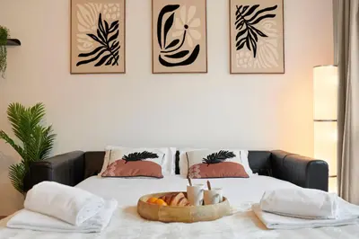 Un ou plusieurs lits dans un hébergement de l'établissement L'Interlude Nantais Appartement proche centre ville