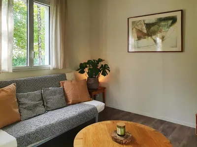 Coin salon dans l'établissement Maison plain-pied avec jardin