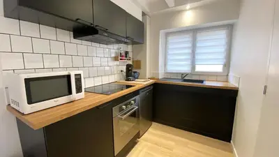 Cuisine ou kitchenette dans l'établissement Maisonnette duplex