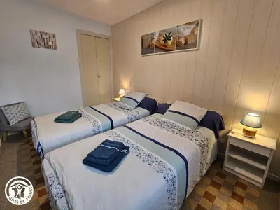 Un ou plusieurs lits dans un hébergement de l'établissement Gîte familial cosy à proximité du Puy du Fou - FR-1-426-598