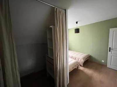 Un ou plusieurs lits dans un hébergement de l'établissement Grande maison 8-10 P avec balcon vue mer