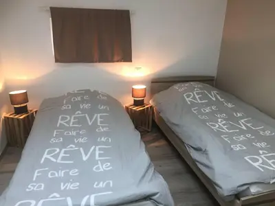 Un ou plusieurs lits dans un hébergement de l'établissement La maison de la chaussée