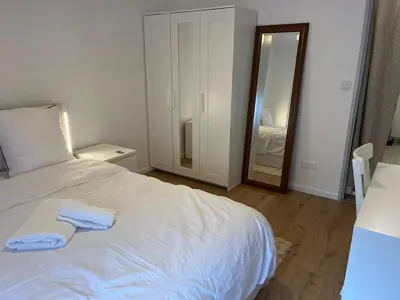 Un ou plusieurs lits dans un hébergement de l'établissement Beautiful apartment located in a quiet residence