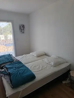 Un ou plusieurs lits dans un hébergement de l'établissement Appartement de charme en plein centre-ville, proche du marché
