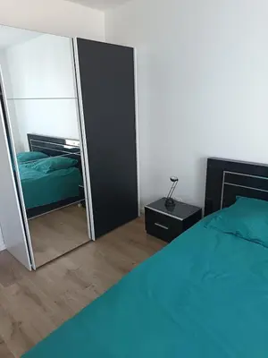 Un ou plusieurs lits dans un hébergement de l'établissement Appartement de charme en plein centre-ville, proche du marché