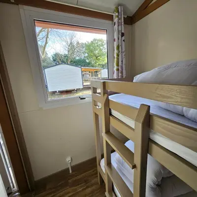 Un ou plusieurs lits dans un hébergement de l'établissement Chalet KABANA