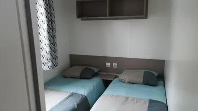 Un ou plusieurs lits dans un hébergement de l'établissement Mobil home 3 chambres Saint Jean de Monts