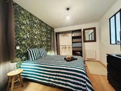 Un ou plusieurs lits dans un hébergement de l'établissement Casa Belfort T2 avec Jardin