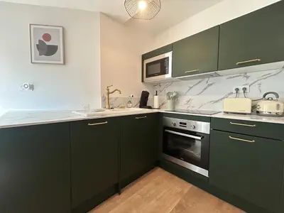Cuisine ou kitchenette dans l'établissement Casa Belfort T2 avec Jardin
