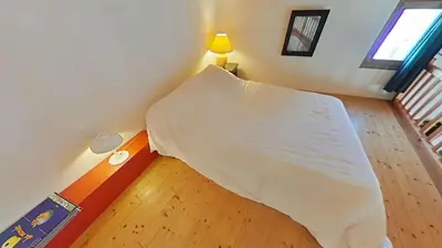 Un ou plusieurs lits dans un hébergement de l'établissement BA000-22C Maison studio mezzanine - 3 couchages BARBATRE