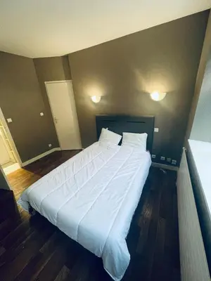 Un ou plusieurs lits dans un hébergement de l'établissement chambre hôte