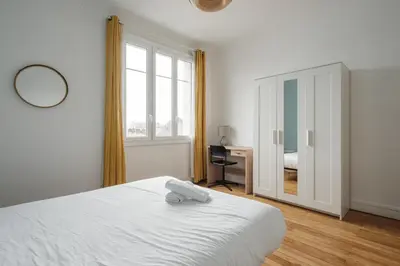 Un ou plusieurs lits dans un hébergement de l'établissement Appartement Spacieux et Lumineux en Centre-Ville