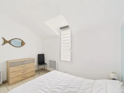 Un ou plusieurs lits dans un hébergement de l'établissement Maison pour 4 avec terrasse à 200m de la plage