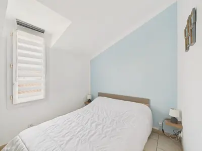 Un ou plusieurs lits dans un hébergement de l'établissement Maison pour 4 avec terrasse à 200m de la plage
