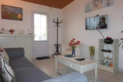 Coin salon dans l'établissement SG000-C19 Mais 4 pièces 6 couchages GIVRAND
