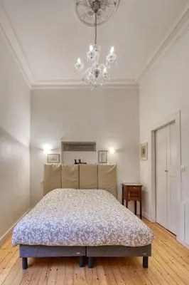 Un ou plusieurs lits dans un hébergement de l'établissement Cœur Historique et Paisible - Hôtel de Ville