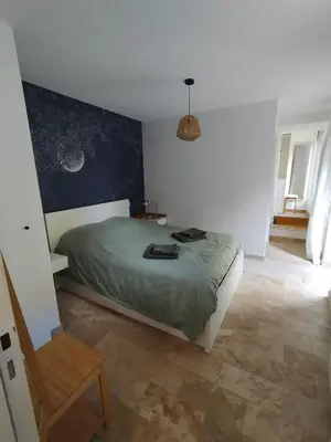 Un ou plusieurs lits dans un hébergement de l'établissement Maison chaleureuse et nature