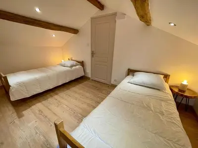 Un ou plusieurs lits dans un hébergement de l'établissement Maison Pautin