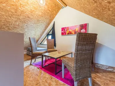 Coin salon dans l'établissement Gîte Rose en campagne avec SPA et Wi-Fi - FR-1-306-1328