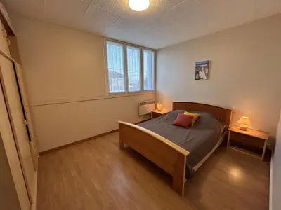 Un ou plusieurs lits dans un hébergement de l'établissement Appartement proche plage, balcon, parking privé - FR-1-224C-364