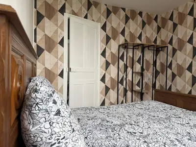 Un ou plusieurs lits dans un hébergement de l'établissement Maison sur les hauteurs de la ville