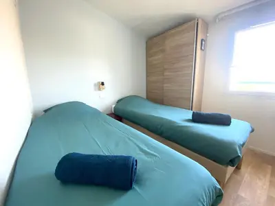 Un ou plusieurs lits dans un hébergement de l'établissement Cottage T3 avec terrasse sur le Golf - piscine