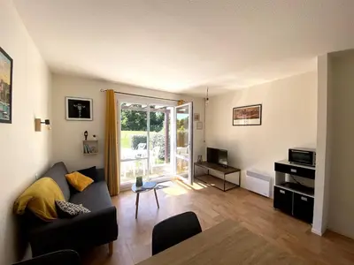 Coin salon dans l'établissement Cottage T3 avec terrasse sur le Golf - piscine