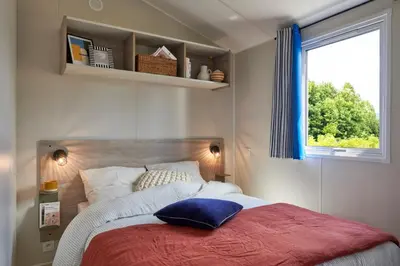 Un ou plusieurs lits dans un hébergement de l'établissement Camping les Chalands Fleuris