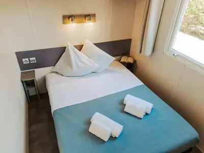 Un ou plusieurs lits dans un hébergement de l'établissement Mobil Home à Saint-Jean-de-Monts pour 4 personnes avec Terrasse - API-1-52-1459