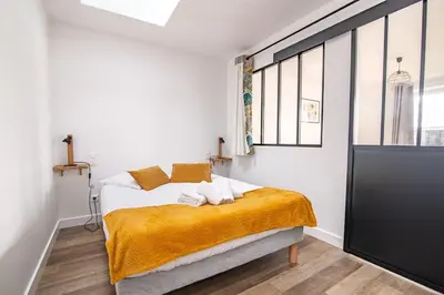 Un ou plusieurs lits dans un hébergement de l'établissement La Tisserande, pratique et proche du PuyduFou
