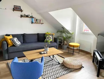 Coin salon dans l'établissement Bel appartement de charme, calme au centre ville MH