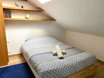 Un ou plusieurs lits dans un hébergement de l'établissement Bel appartement de charme, calme au centre ville MH