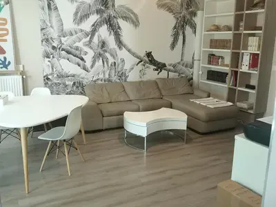 Coin salon dans l'établissement Grand appartement avec terrasse et parking