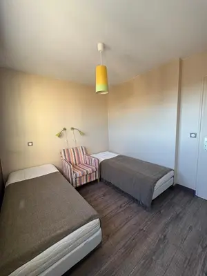 Un ou plusieurs lits dans un hébergement de l'établissement Bel appartement front de mer