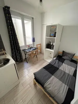 Un ou plusieurs lits dans un hébergement de l'établissement Studio GARE hyper centre ville Angers