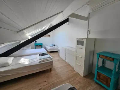 Un ou plusieurs lits dans un hébergement de l'établissement Villa 11 pers 4CH - Jacuzzi - Le Cormier