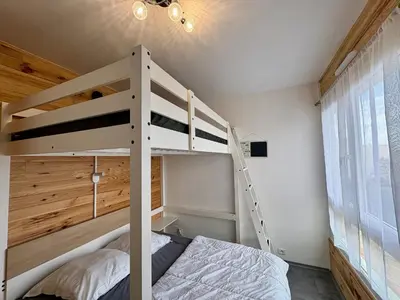 Un ou plusieurs lits dans un hébergement de l'établissement Appartement rénové face mer avec parking - 6 pers - FR-1-323-597