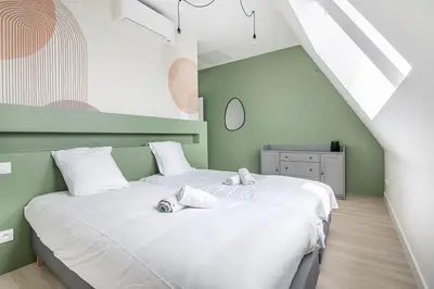 Un ou plusieurs lits dans un hébergement de l'établissement Le Jungle, moderne et cozy!
