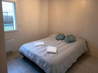 Un ou plusieurs lits dans un hébergement de l'établissement Maison 4 personnes avec jardin à 15 min du grand Parc
