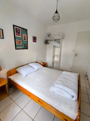 Un ou plusieurs lits dans un hébergement de l'établissement L' Appartement