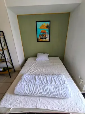 Un ou plusieurs lits dans un hébergement de l'établissement L' Appartement