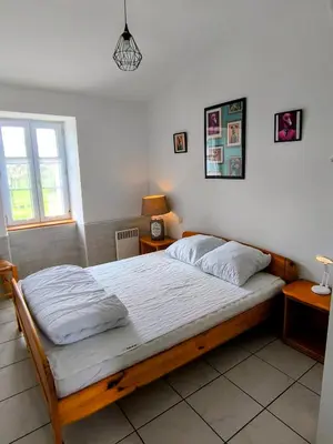 Un ou plusieurs lits dans un hébergement de l'établissement L' Appartement